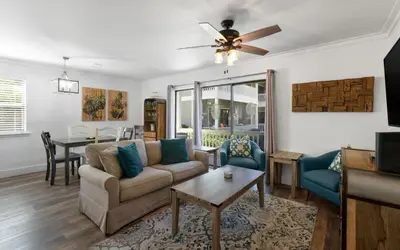 a living room with a couch and a table at Beachwood 8G in Santa Rosa Beach