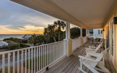 a porch with chairs and a view of the ocean at Ethridge House in Santa Rosa Beach