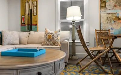 a living room with a couch and a table at Four Palms in Santa Rosa Beach