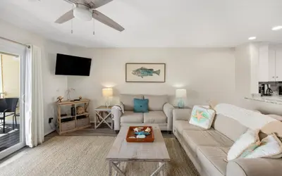 a living room with a couch and a table at Happy Oasis in Inlet Beach