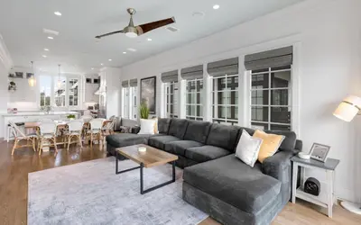a living room with a couch and a table at Heaven on Pointe in Santa Rosa Beach