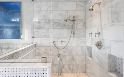 a white bathroom with a shower and a tub at Heaven on Pointe in Santa Rosa Beach
