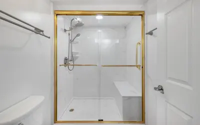a shower with a glass door in a bathroom at High Pointe Unit 2-223 in Rosemary Beach