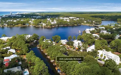 an aerial view of a town on a lake at LakeTide Retreat in Santa Rosa Beach