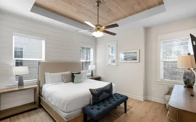 a bedroom with a bed and a ceiling fan at Once Upon A Tide in Inlet Beach