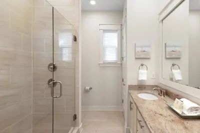 a bathroom with a shower and a sink at Once Upon A Tide in Inlet Beach