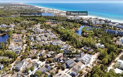 an aerial view of a residential neighborhood with the beach and ocean at Out of Office in Santa Rosa Beach