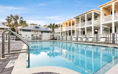 a large swimming pool in front of a building at Saltwater Song in Santa Rosa Beach
