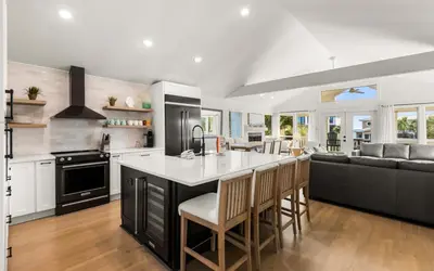 a kitchen with a large island with a counter top at Sea n Stars in Seacrest