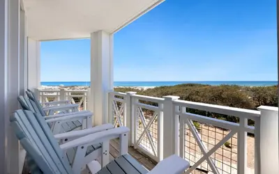 a balcony with chairs and a view of the ocean at The Crossings at Watersound Beach C214 in Inlet Beach