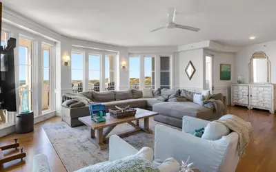 a living room with couches and a table at The Crossings at Watersound Beach C214 in Inlet Beach