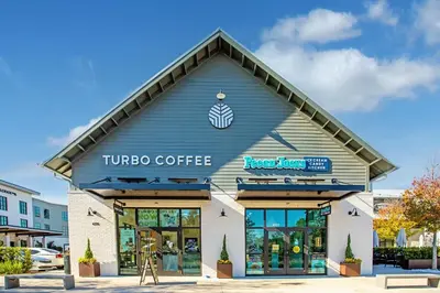 a tinto coffee building with a sign on it at Sea Turtle House- Lux Townhome- Pool - Golf Cart in Santa Rosa Beach