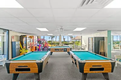 two billiard tables in a gaming room at Breathtaking Sunset View Beachfront Condo Resort in Panama City Beach