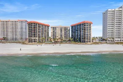 a view of a beach with tall buildings and the ocean at Breathtaking Sunset View Beachfront Condo Resort in Panama City Beach