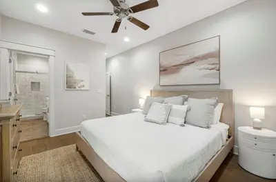 a bedroom with a bed and a ceiling fan at Sleeps 18 | Bikes | Sunshine State of Mind | 30A | Pool | Beach Access in Inlet Beach