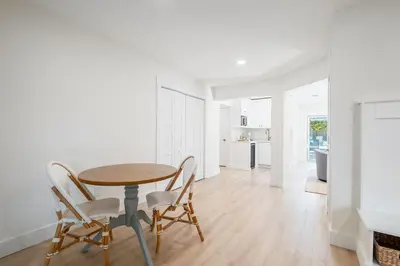 a kitchen and dining room with a table and chairs at Backyard Oasis ,Pool, Sandy Magnolia, Sleeps 16,Eastern Lake, Golf Cart,Bikes in Santa Rosa Beach
