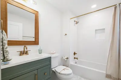 a bathroom with a sink and a toilet and a shower at Backyard Oasis ,Pool, Sandy Magnolia, Sleeps 16,Eastern Lake, Golf Cart,Bikes in Santa Rosa Beach