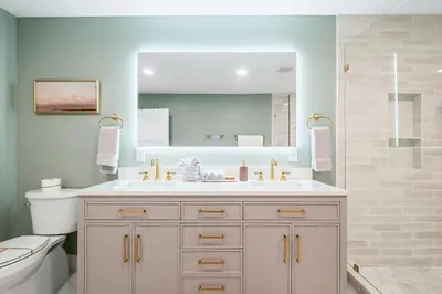 a bathroom with a sink and a toilet and a mirror at Backyard Oasis ,Pool, Sandy Magnolia, Sleeps 16,Eastern Lake, Golf Cart,Bikes in Santa Rosa Beach