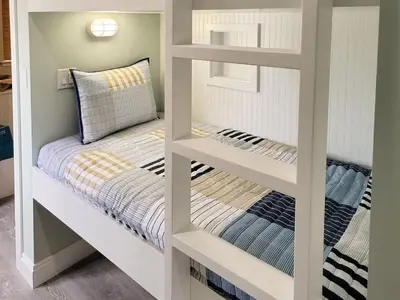 a couple of bunk beds in a room at 2 The Sea- Private Beach- Pool in Santa Rosa Beach