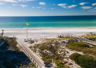 an aerial view of a beach with a yellow flag at Beachside Villa 811 in Santa Rosa Beach