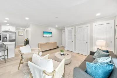 a living room with a couch and a table at Beachside Villa 811 in Santa Rosa Beach