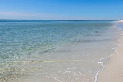 a beach with a body of water and the ocean at 30A Retreat - Patio Shared Pool in Inlet Beach