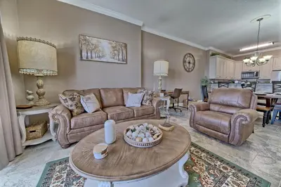 a living room with a couch and a table at Ocean Reef in Panama City Beach