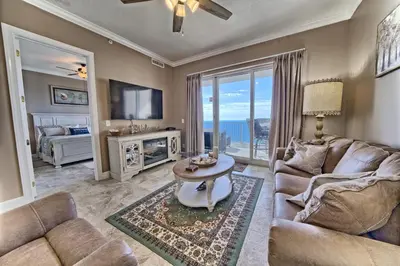 a living room with a couch and a table at Ocean Reef in Panama City Beach