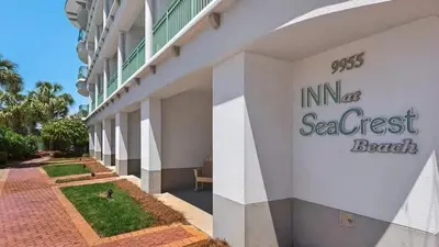 a building with a sign on the side of it at The Inn at Seacrest Beach Unit 207 in Rosemary Beach