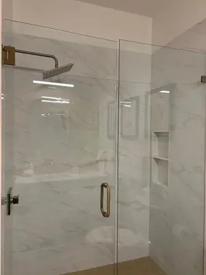 a shower with a glass door in a bathroom at The Inn at Seacrest Beach Unit 207 in Rosemary Beach