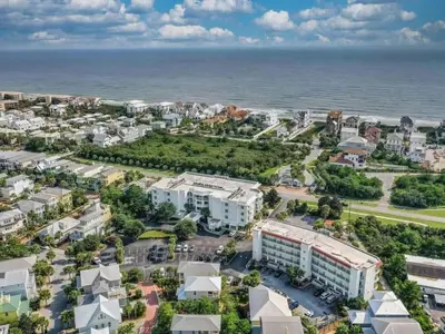 an aerial view of a resort with the ocean at The Inn at Seacrest Beach Unit 207 in Rosemary Beach