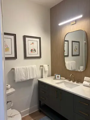 a bathroom with a sink and a large mirror at The Inn at Seacrest Beach Unit 207 in Rosemary Beach