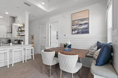a kitchen and dining room with a table and chairs at UPDATED unit in Prominence - Resort Pool, Golf Cart on 30A in Watersound, FL in Inlet Beach