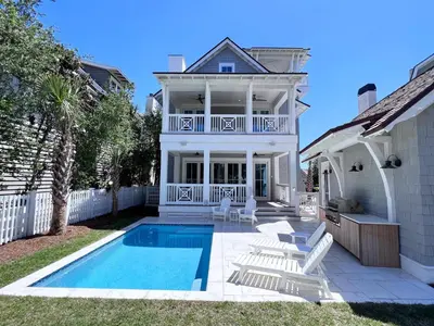 a house with a swimming pool in the yard at Watersound 13 in Watersound Beach