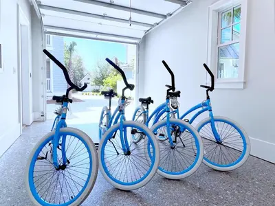 four blue bikes parked next to a building at Watersound 13 in Watersound Beach