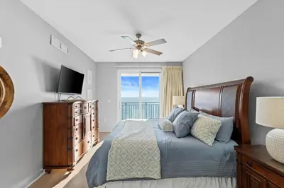 a bedroom with a bed with a view of the ocean at Sterling Breeze 607 | Gulf-Front 3BR Condo | 6th Floor Balcony, Infinity Pool, Direct Beach Access in Panama City Beach