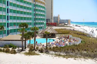a resort with a swimming pool next to a beach at Emerald Beach 1736 by Emerald Coast Retreats in Panama City Beach