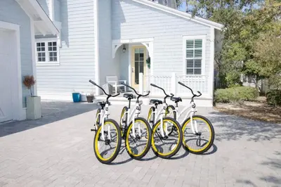 four bikes parked in front of a house at Second Star Shores in Watersound Beach