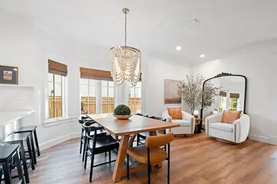 a dining room and living room with a table and chairs at Private Pool, Impulse Buy The Sea, Sleeps 13, Beach Access in Inlet Beach