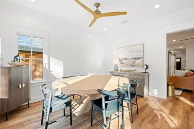 a dining room with a table and chairs and a ceiling fan at Private Pool, Impulse Buy The Sea, Sleeps 13, Beach Access in Inlet Beach