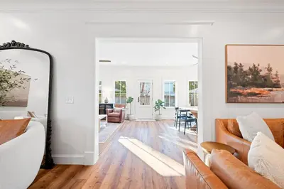 a living room with a couch and a mirror at Private Pool, Impulse Buy The Sea, Sleeps 13, Beach Access in Inlet Beach