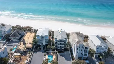 an aerial view of a resort with the beach at Camelot in Seagrove Beach
