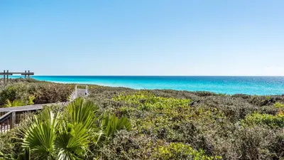 a path to the beach with the ocean in the background at Camelot in Seagrove Beach