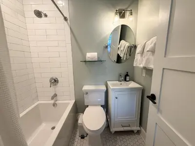a bathroom with a toilet and a tub and a sink at Bella Sol by 30A Escapes in Rosemary Beach