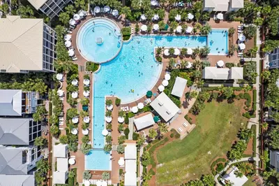 an overhead view of a pool at a resort at Bella Sol by 30A Escapes in Rosemary Beach