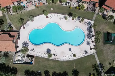 an overhead view of a swimming pool at a resort at Resort Townhome with Free Golf Cart in Panama City Beach
