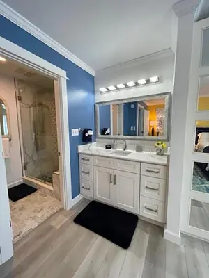 a bathroom with a shower and a sink and a mirror at Seagull Villas #3 by Emerald Coast Retreats in Panama City Beach