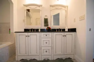 a white bathroom with a sink and a mirror at Seagull Villas #7 by Emerald Coast Retreats in Panama City Beach
