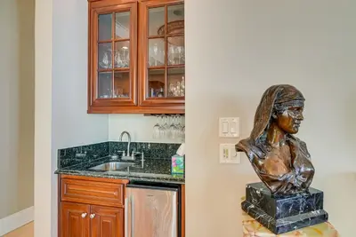 a statue of a woman sitting on a box in a kitchen at Like No Other in the Panhandle of Florida in Seacrest