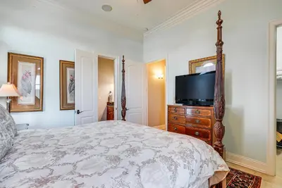 a bedroom with a bed and a flat screen tv at Like No Other in the Panhandle of Florida in Seacrest